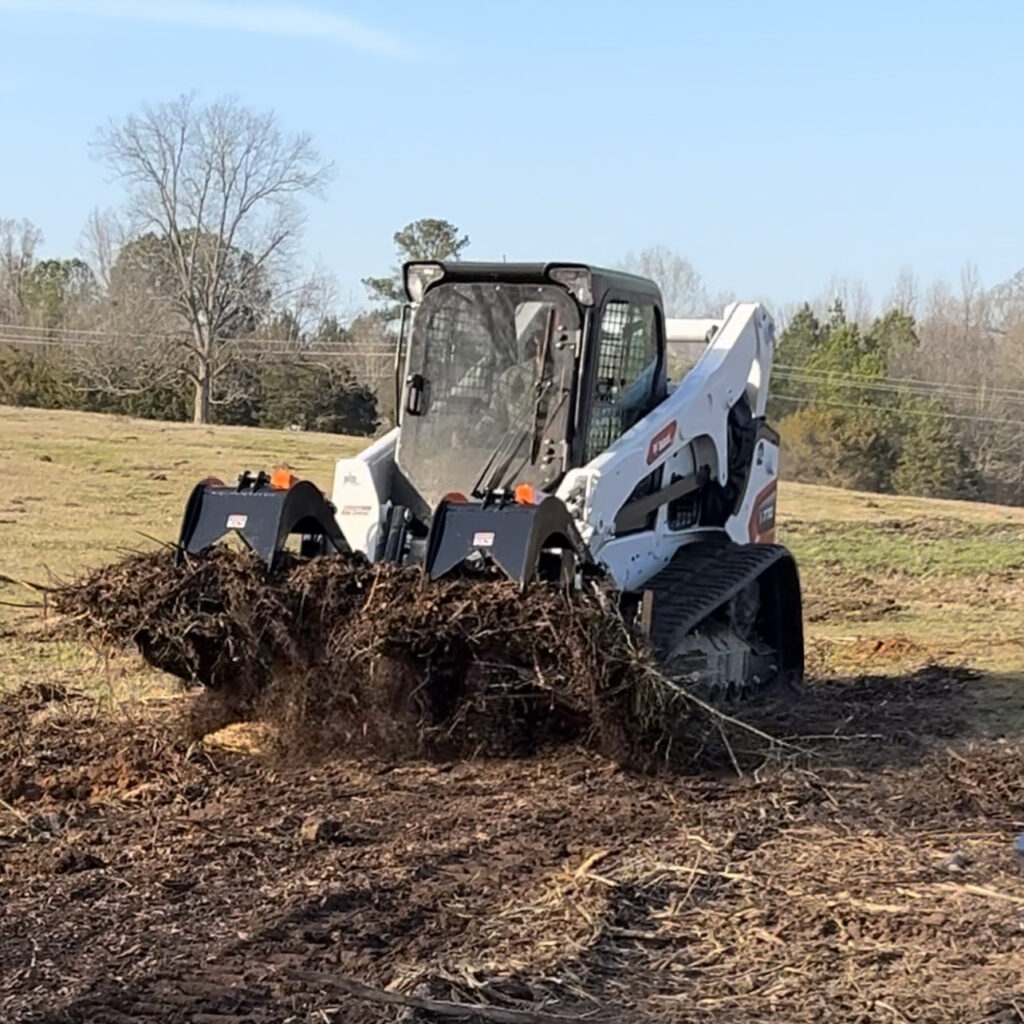 John Wayne Clearing & Grading Debris Removal Using Bobcat with SkidPro Grapple Bucket